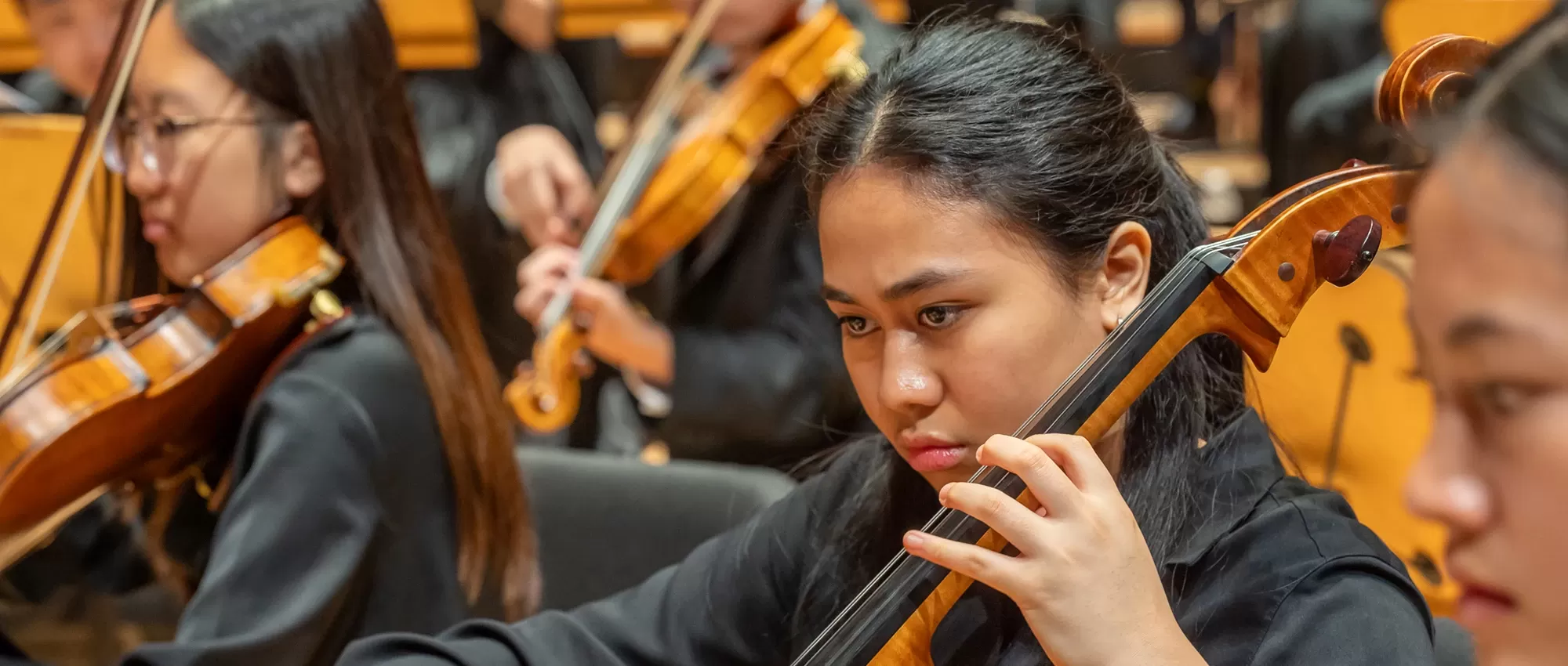 Cellist playing with Pacific Symphony Youth Orchestra