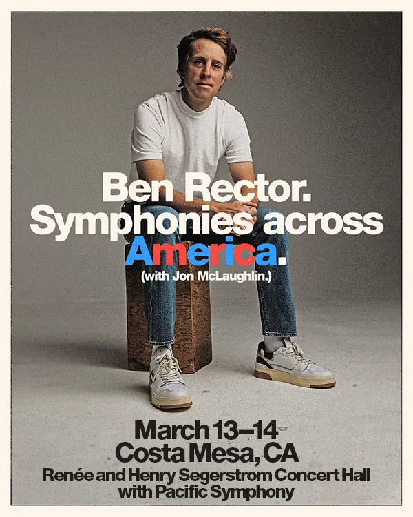 Ben Recter in a white t-shirt with his arms crossed across his abdomen