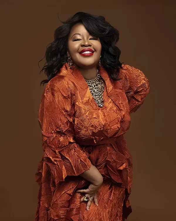 Soprano Karen Slack in an orange dress