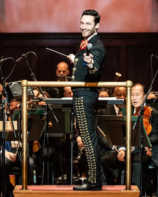 The Three Mexican Tenors performing on stage with an orchestra