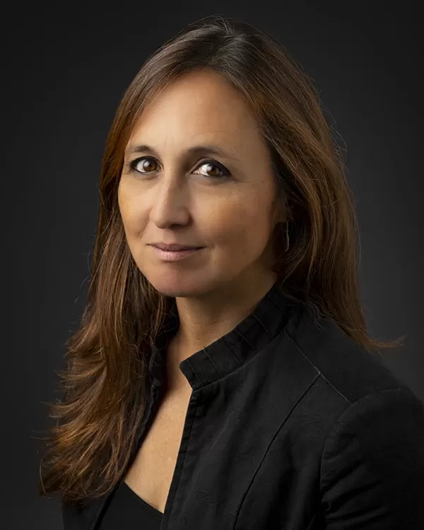 Young woman conductor looking straight ahead