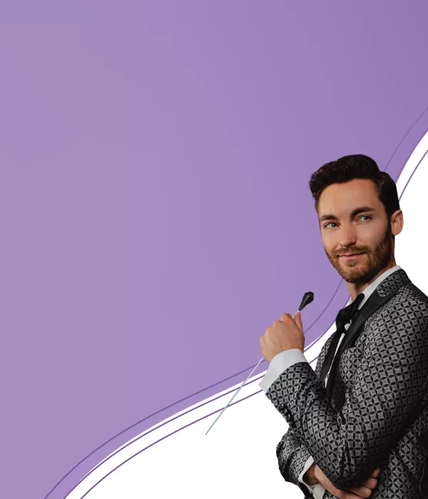 Man in a suit with a conductor's baton