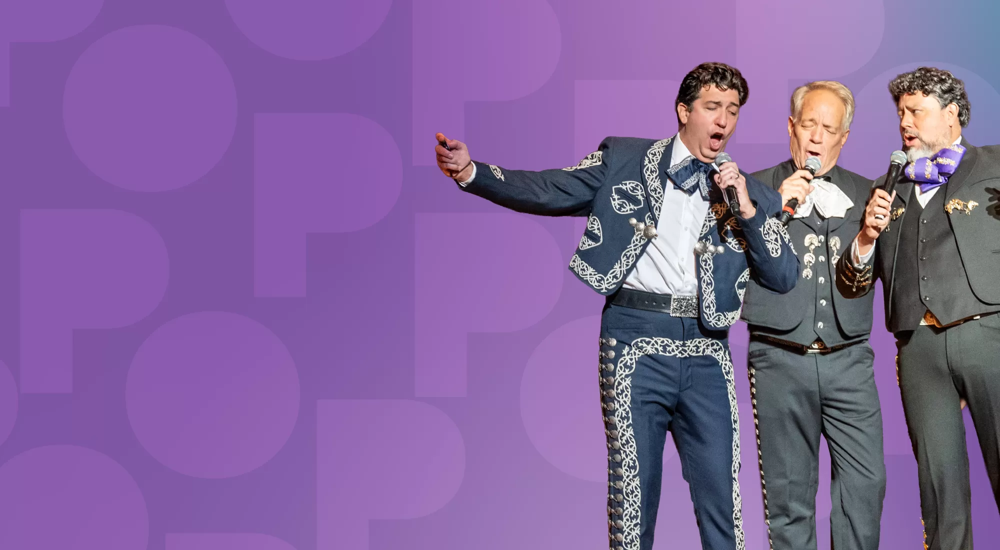 Three singers in Mexican suits