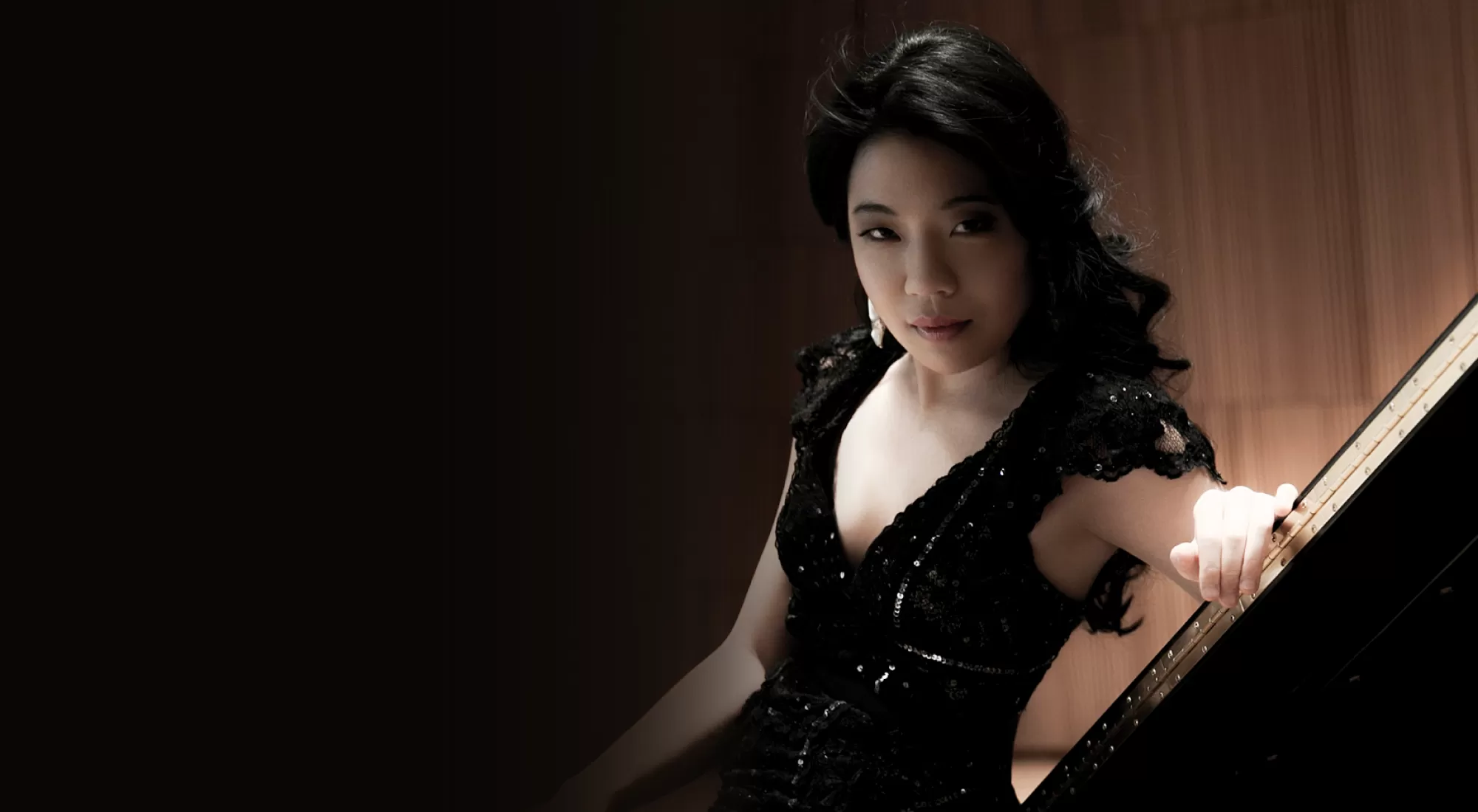 dark-haired woman in a black dress