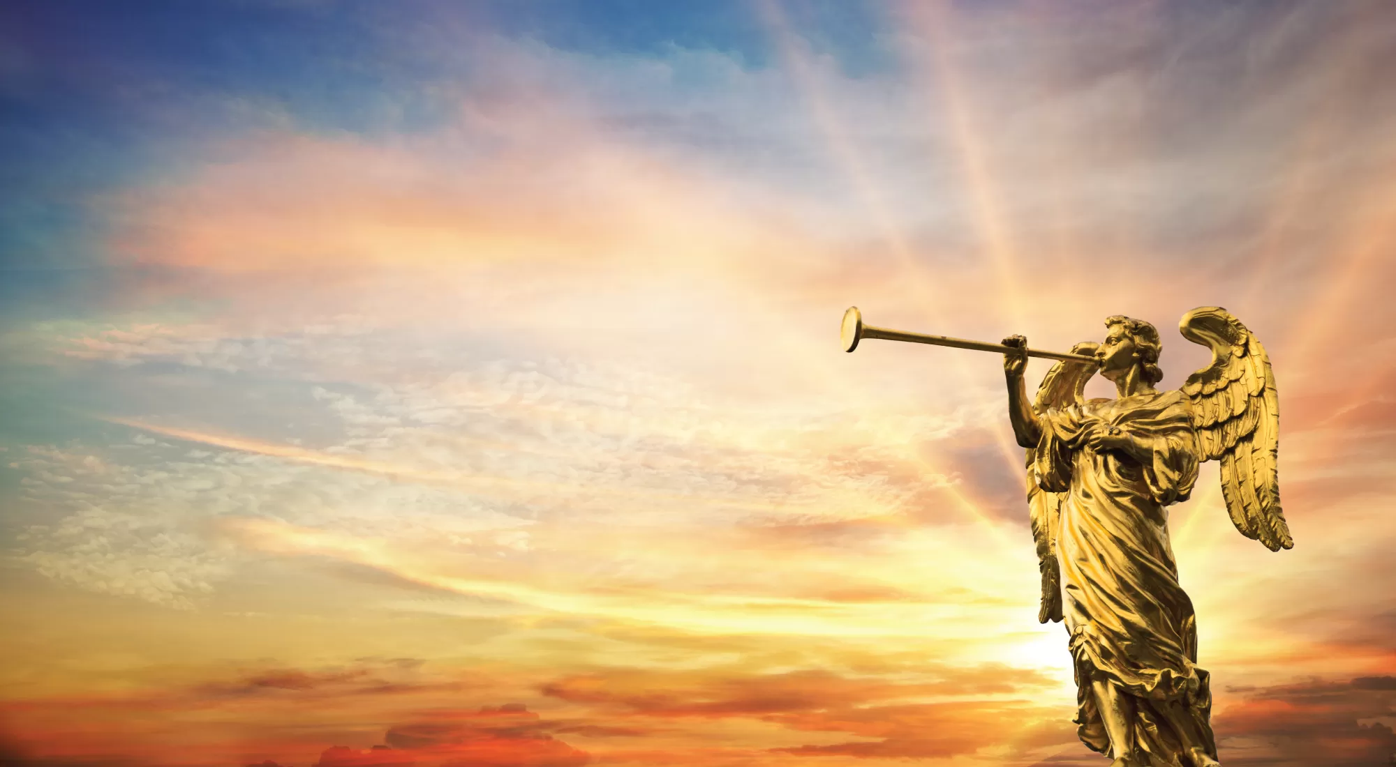 An angel blowing a trumpet with a sunrise in the background