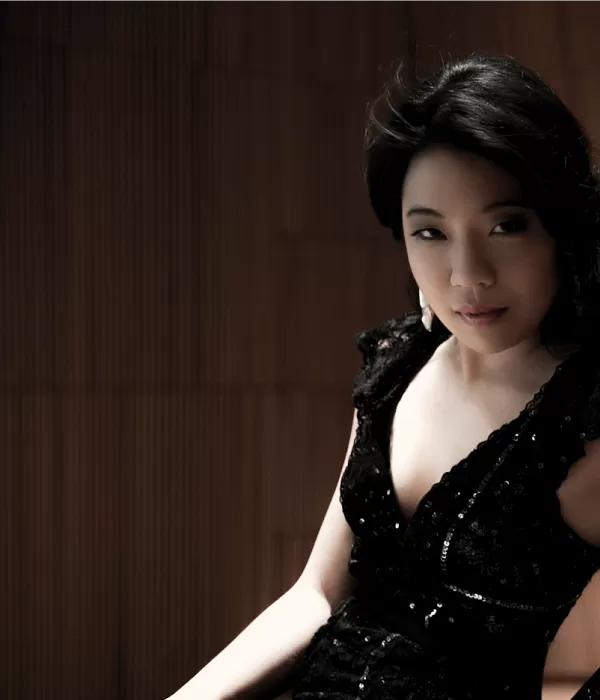dark-haired woman in a black dress